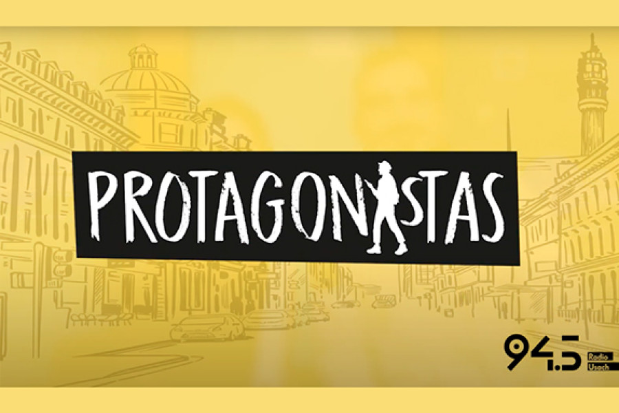 En la pantalla se lee el título del programa "PROTAGONISTAS" en letras blancas y fondo negro. Todo sobre un fondo amarillo