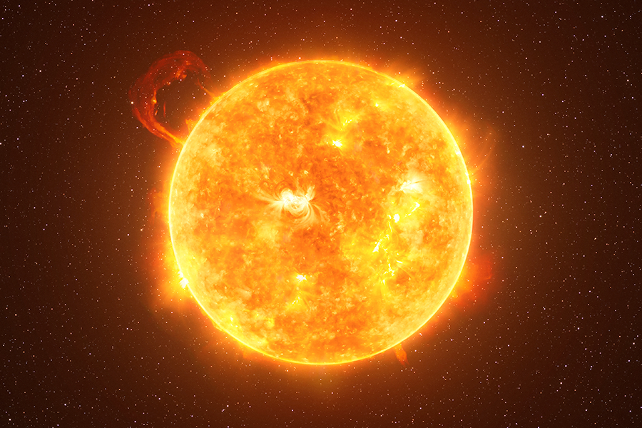 Imagen de la superficie radiante del sol sobre fondo oscuro.